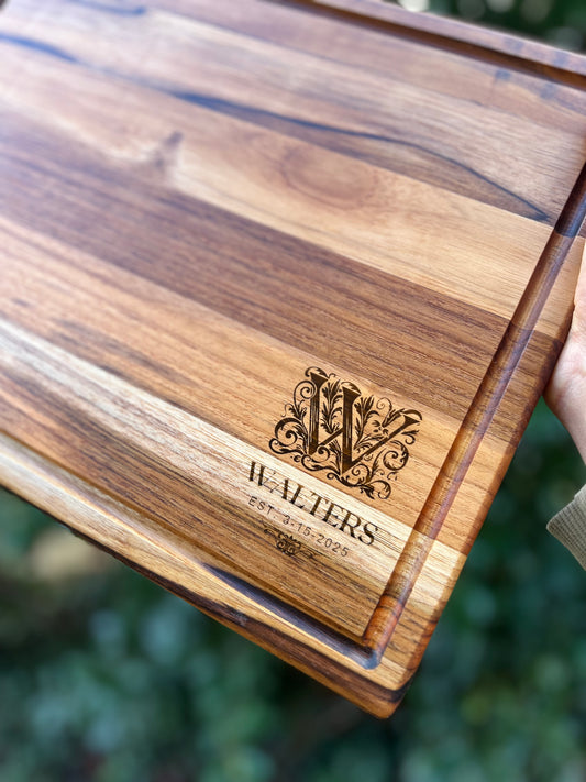 Personalized teak cutting board with monogram and established date