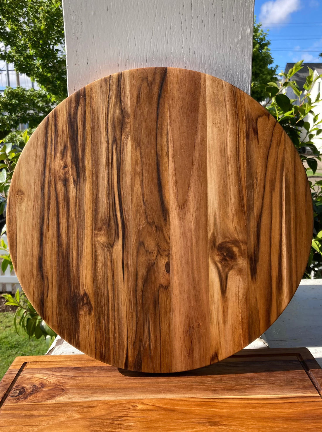 Round teak serving board for entertaining