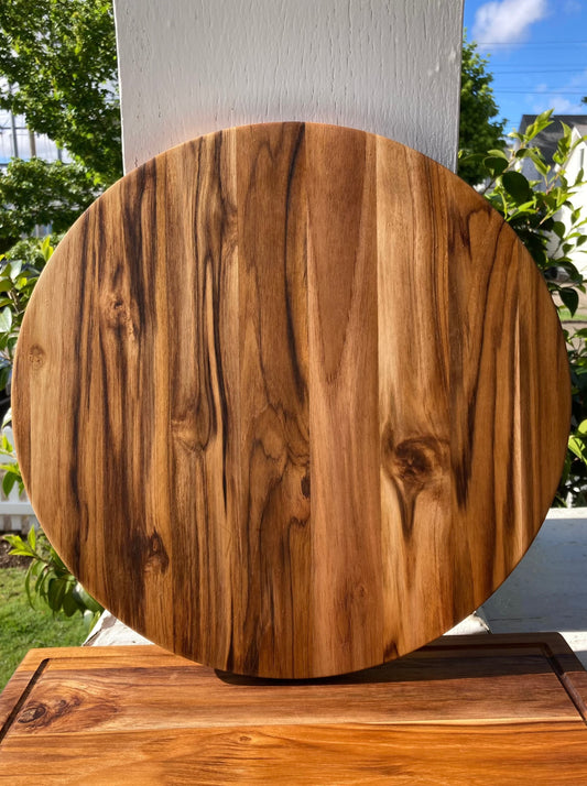 Round teak serving board for entertaining