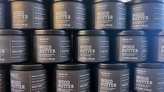 Stacked tins of NW Co. Wood Butter beeswax board conditioner, hand-poured in Albany, Oregon
