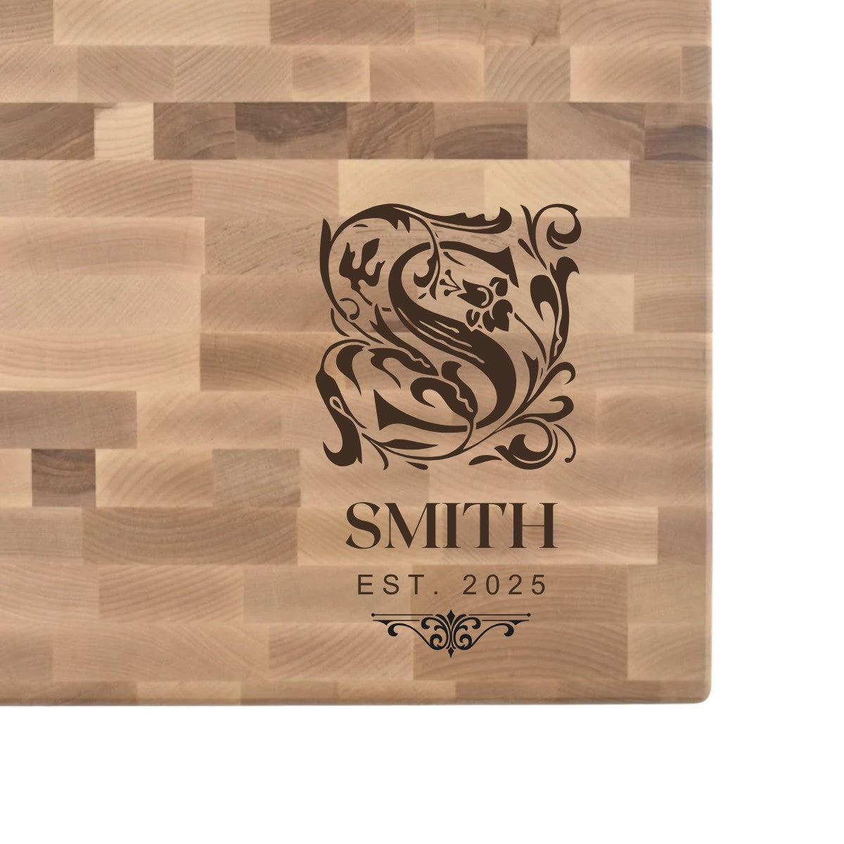 Hard maple end grain butcher block engraved with an ornate monogram initial, family name, and EST. date