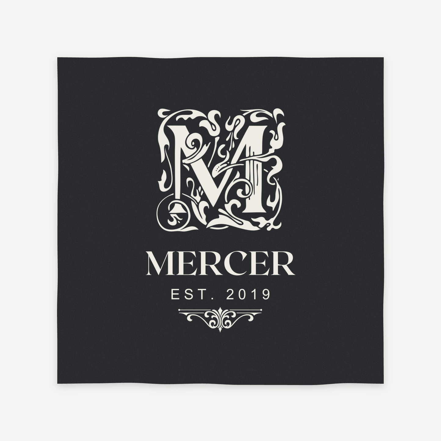 Ornate monogram engraving layout preview for a personalized slate coaster