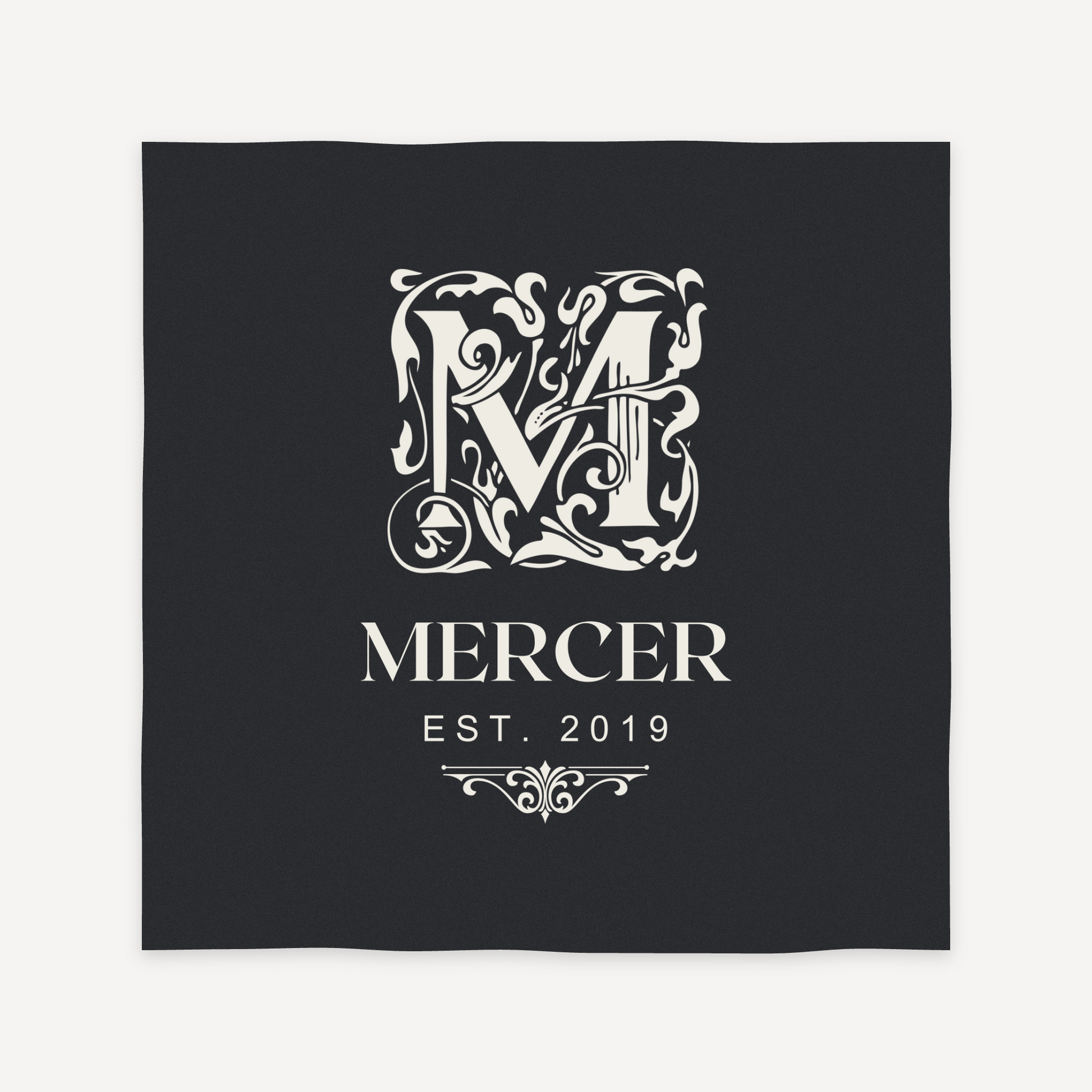 Ornate monogram engraving layout preview for a personalized slate coaster