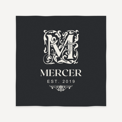 Ornate monogram engraving layout preview for a personalized slate coaster