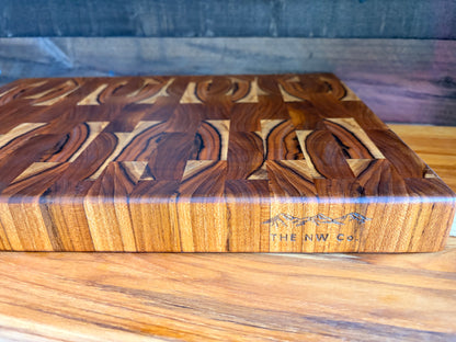 Teak end grain butcher block, angled view showing thickness and branded maker's mark